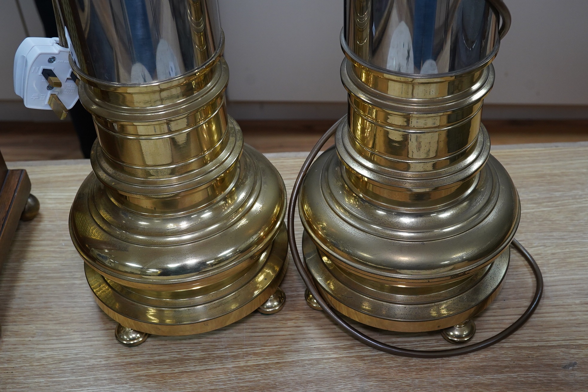 A pair of contemporary brass and chrome lamp stems, 86cm total. Condition - fair to good, not tested